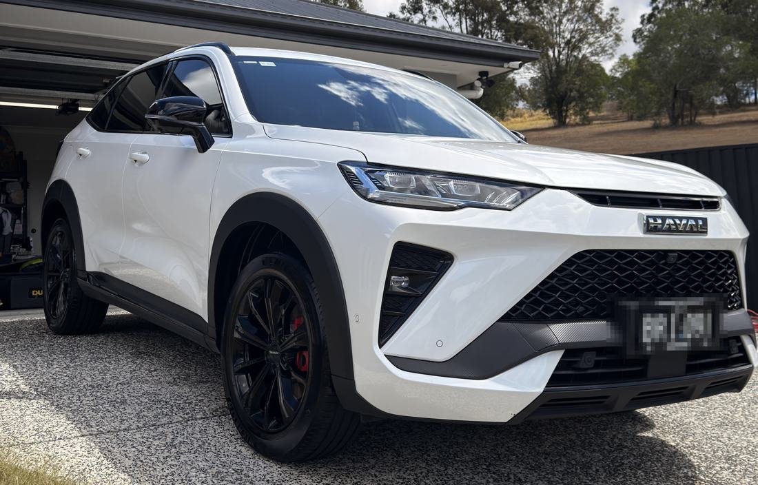 White Haval SUV with black wheels