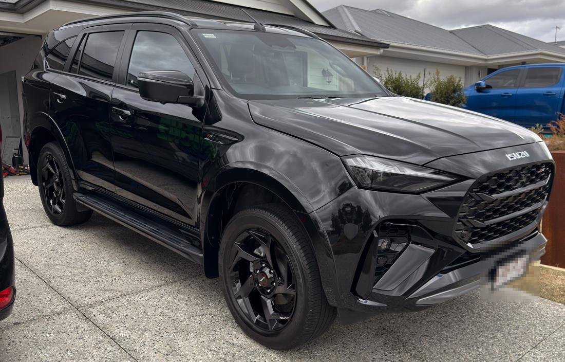 Black Isuzu MU-X, front view